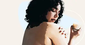 photo of woman applying lotion